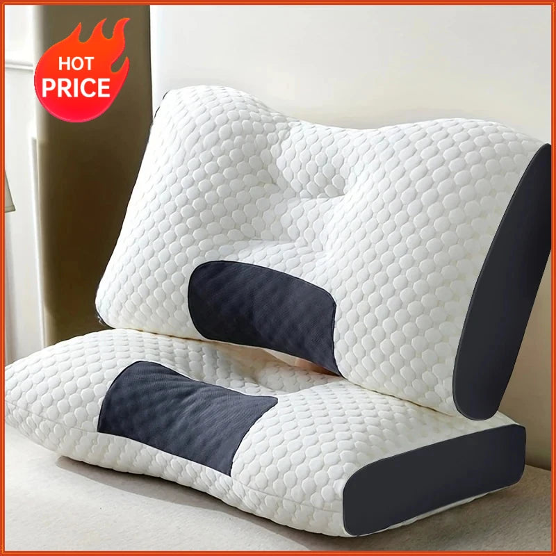 A white ergonomic contour neck pillow with dark gray accents is shown on a light surface.