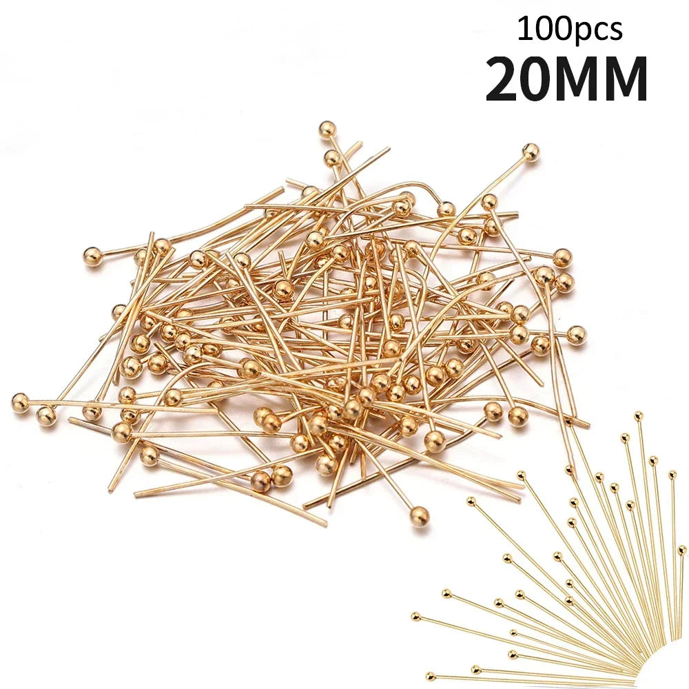 A pile of 100 stainless steel ball head pins, 20mm long, used for jewelry making.