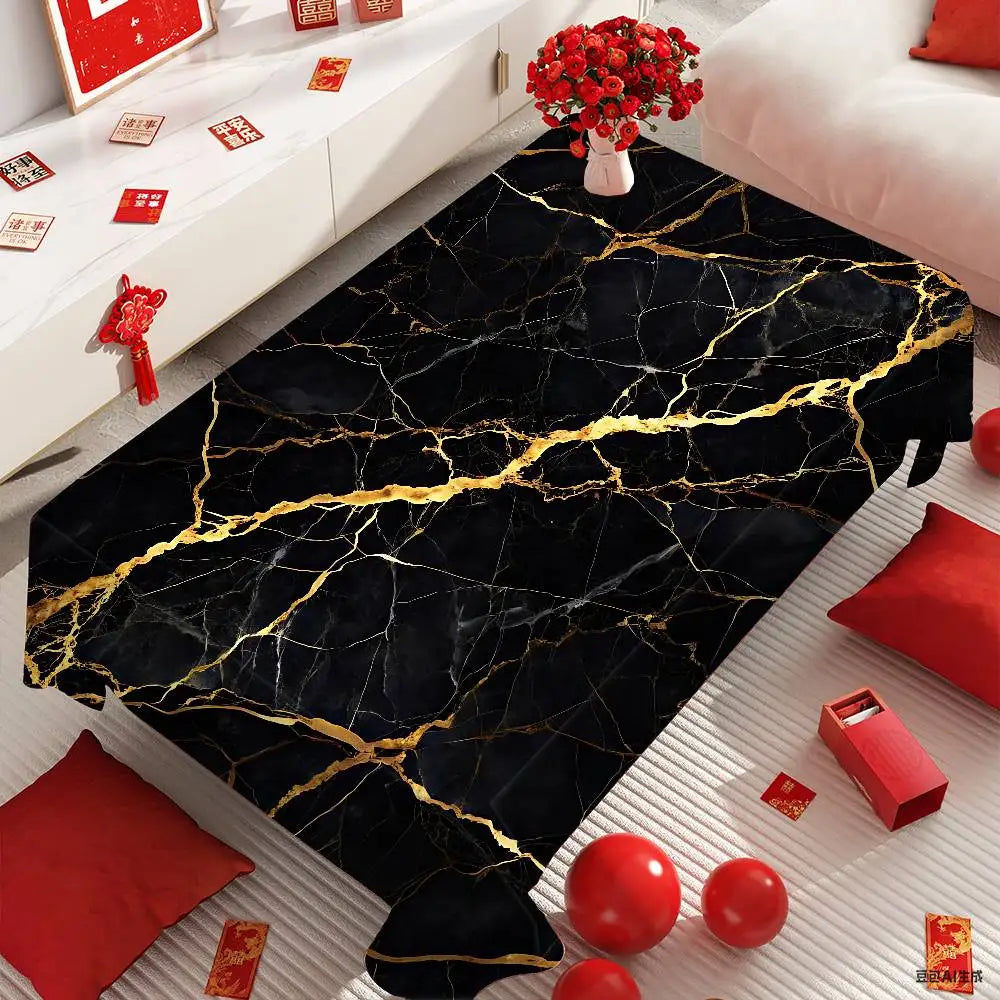 A black marble pattern table cloth with gold veining displayed on a white surface.