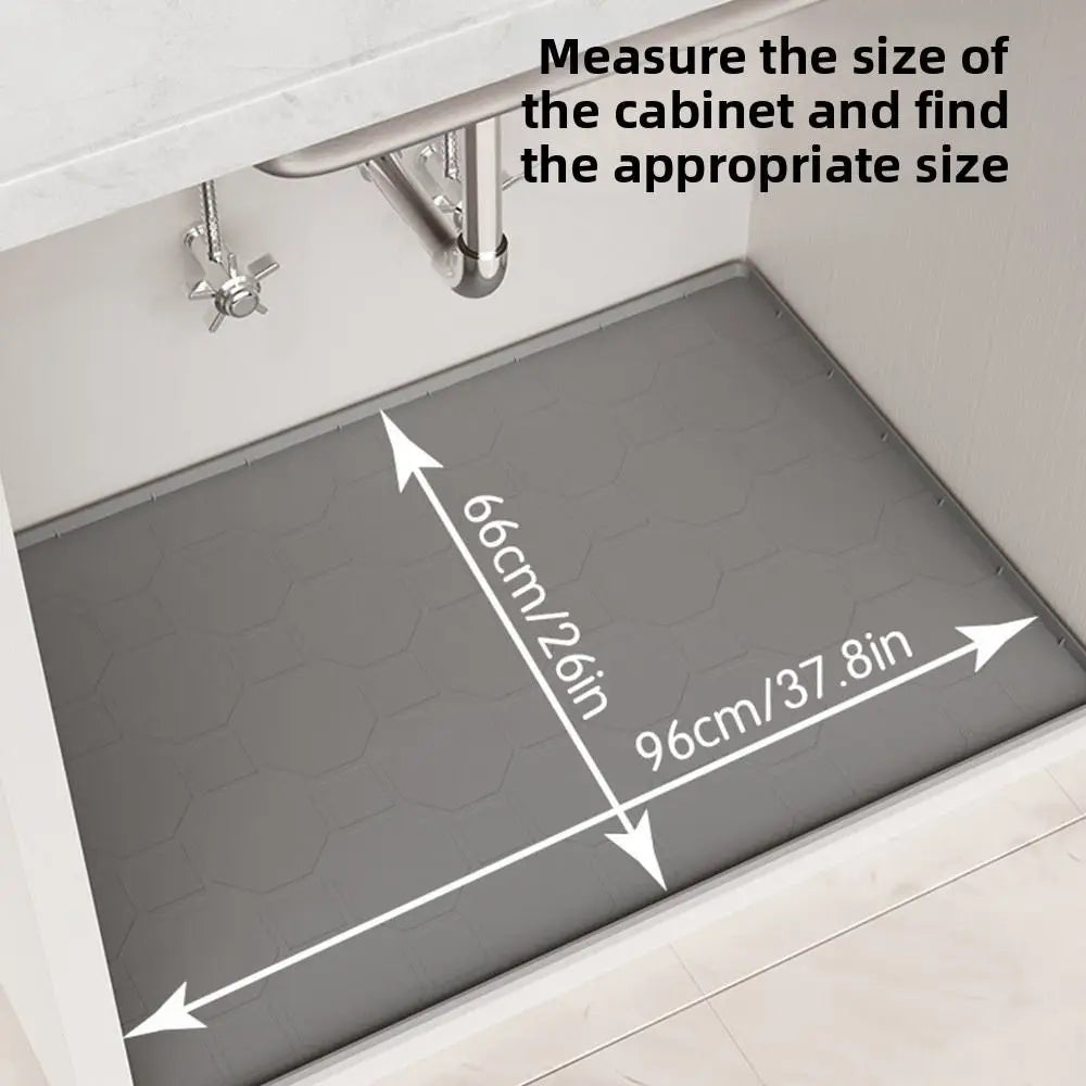 A silicone cabinet liner mat is shown being measured for proper sizing inside a kitchen cabinet.