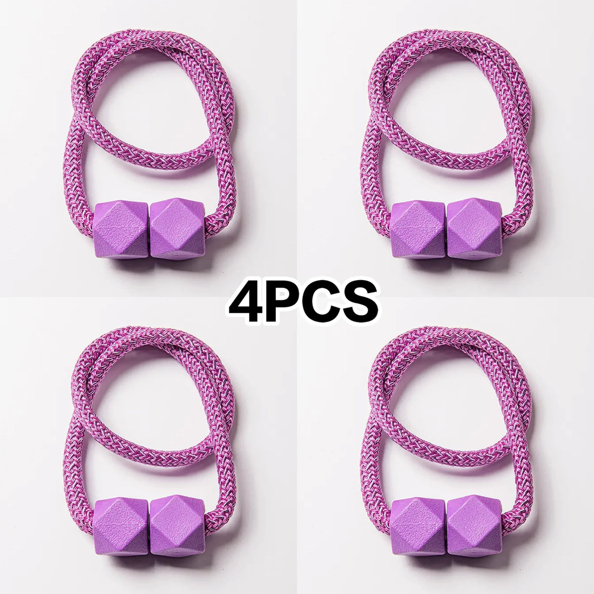 A set of four purple magnetic curtain tiebacks with a woven cord texture.