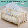 A wooden crib with a sheer mosquito net covering, suitable for baby beds below 90 x 50cm.