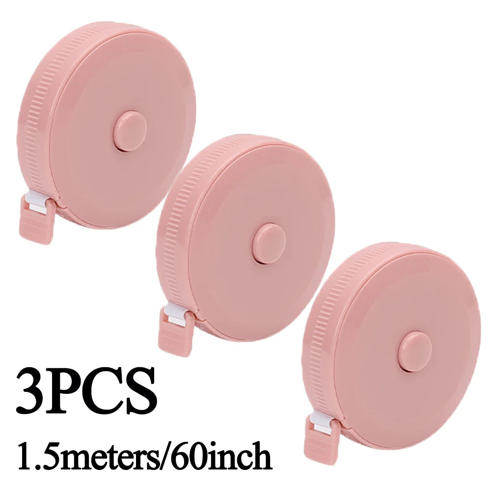 Three pink retractable double-sided measurement tapes, 1.5 meters long.