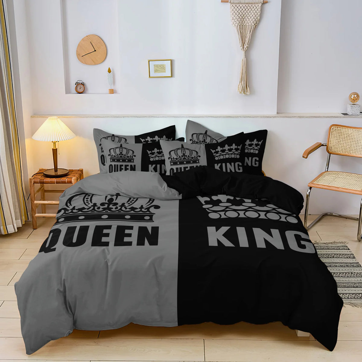 A set of three black and grey couple themed duvet covers displayed on a bed.