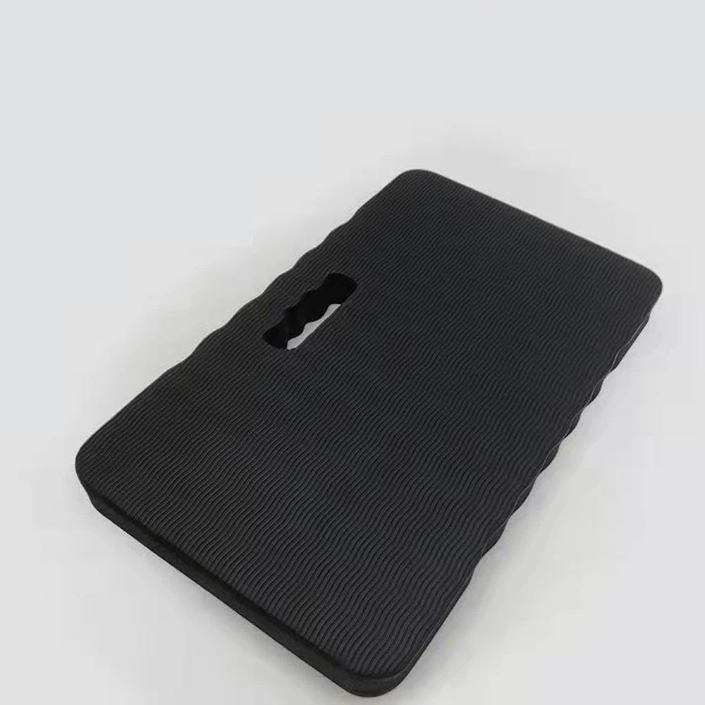 A black thick protective kneeling mat designed for use on hard floors.