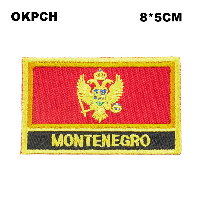 Embroidered patch of the Montenegro flag featuring a golden eagle on a red background.