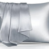 A silver silky satin toddler pillowcase folded and displayed on a reflective surface.
