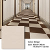 A long hallway featuring a checkered beige and brown carpet pattern.