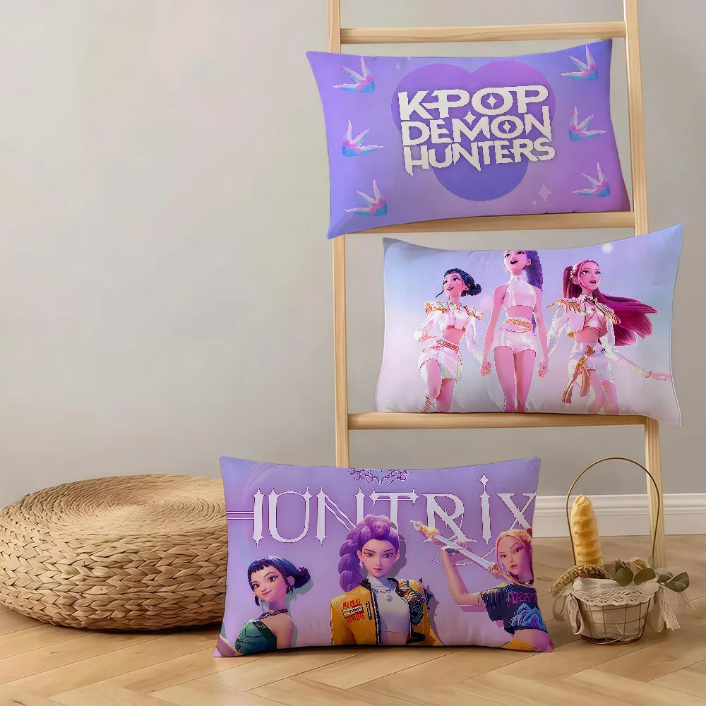 Three cushion covers featuring K-Pop Demon Hunters themes and characters on a wooden rack.