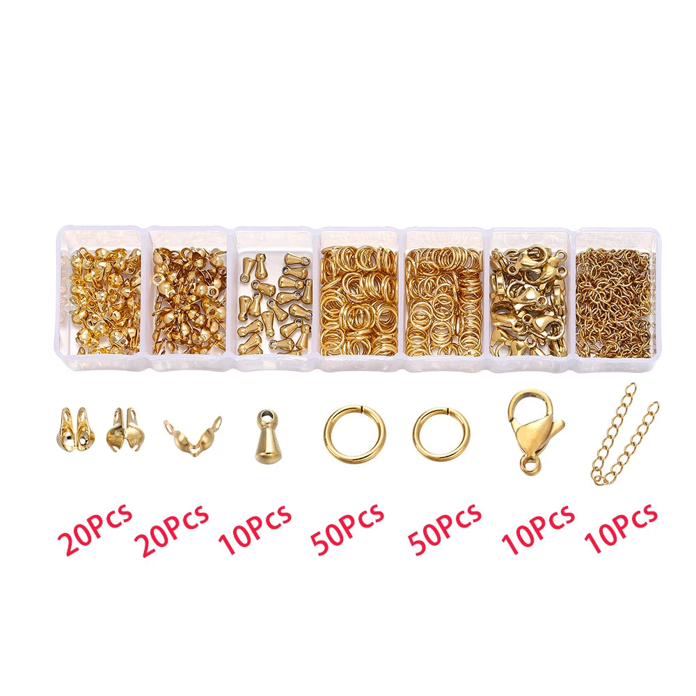 A collection of gold-colored lobster clasp findings and jewelry components packaged in small plastic compartments.
