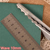 A stainless steel pinking shear is shown next to a ruler marked in centimeters, demonstrating its 10mm wave.
