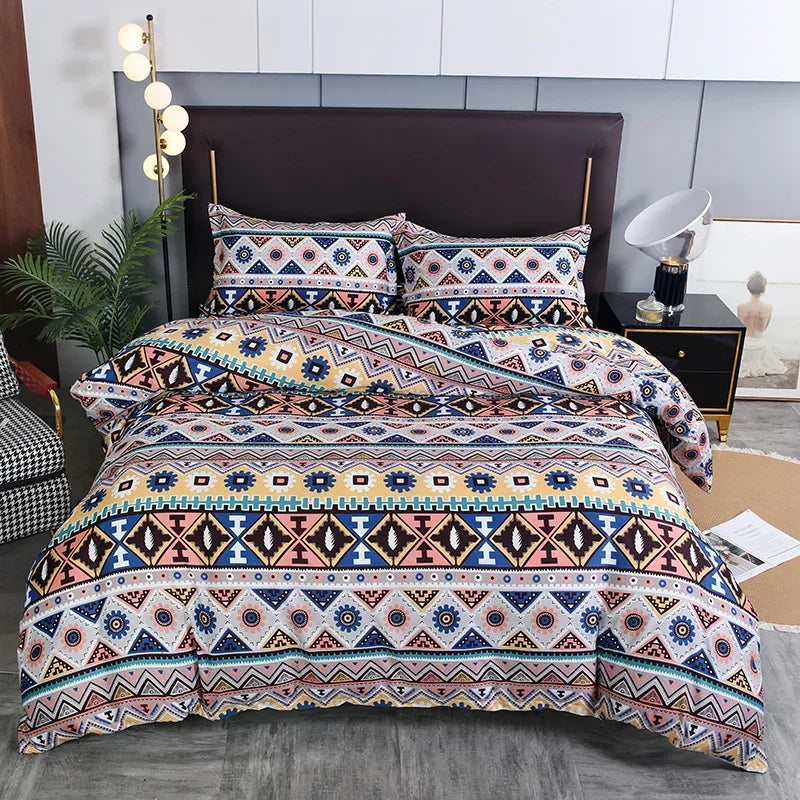 Boho geometric duvet cover set featuring a patterned quilt on a bed.
