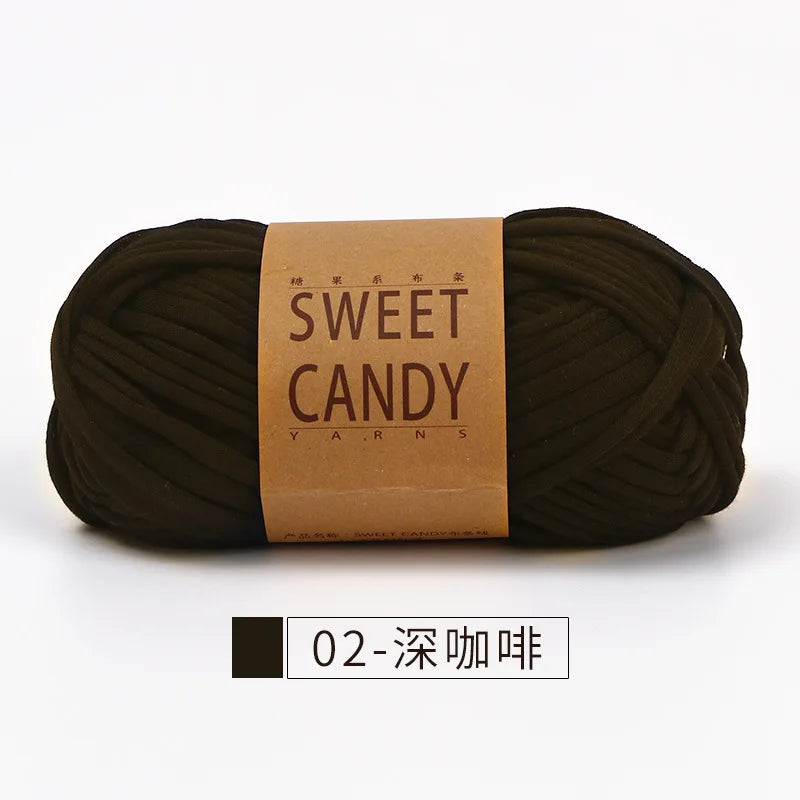 A skein of dark brown sweet candy yarn labeled with Japanese text, ready for crochet or knitting.