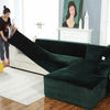 A dark emerald green velvet L-shaped sectional sofa in a modern living room setting.