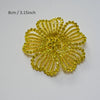 A bright yellow rhinestone flower applique patch with a textured, daisy-like design.