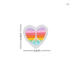 A heart-shaped embroidered patch featuring a rainbow design with a peace sign in the center.