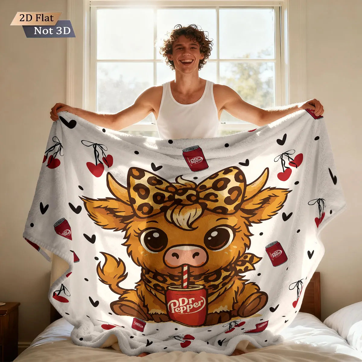 A person is lying down and holding a large flannel blanket featuring a cartoon Highland cow print.