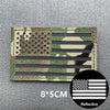 Tactical USA flag patch featuring stars and stripes on a camouflage background with reflective material