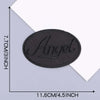 A black oval embroidered leather patch with the word Angel on it, shown against a white background.