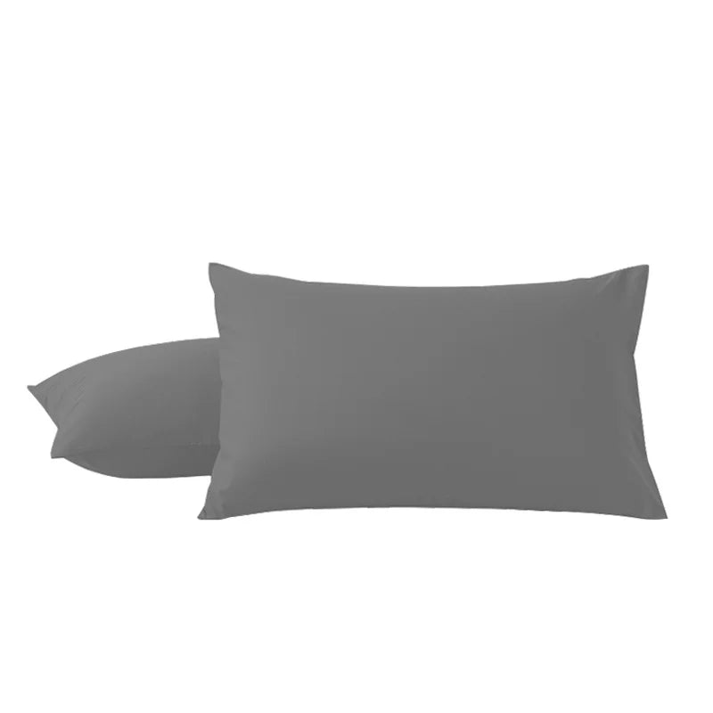 A pair of solid gray microfiber pillow covers lying flat.
