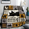 A black and gold patterned flannel throw blanket featuring various cat illustrations.
