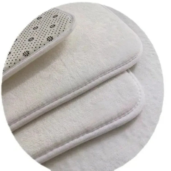 A white luxury kitchen and home floor mat with a textured surface and decorative stitching.