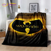 A dark fabric throw blanket featuring a large yellow silhouette of a stylized character on a black background.