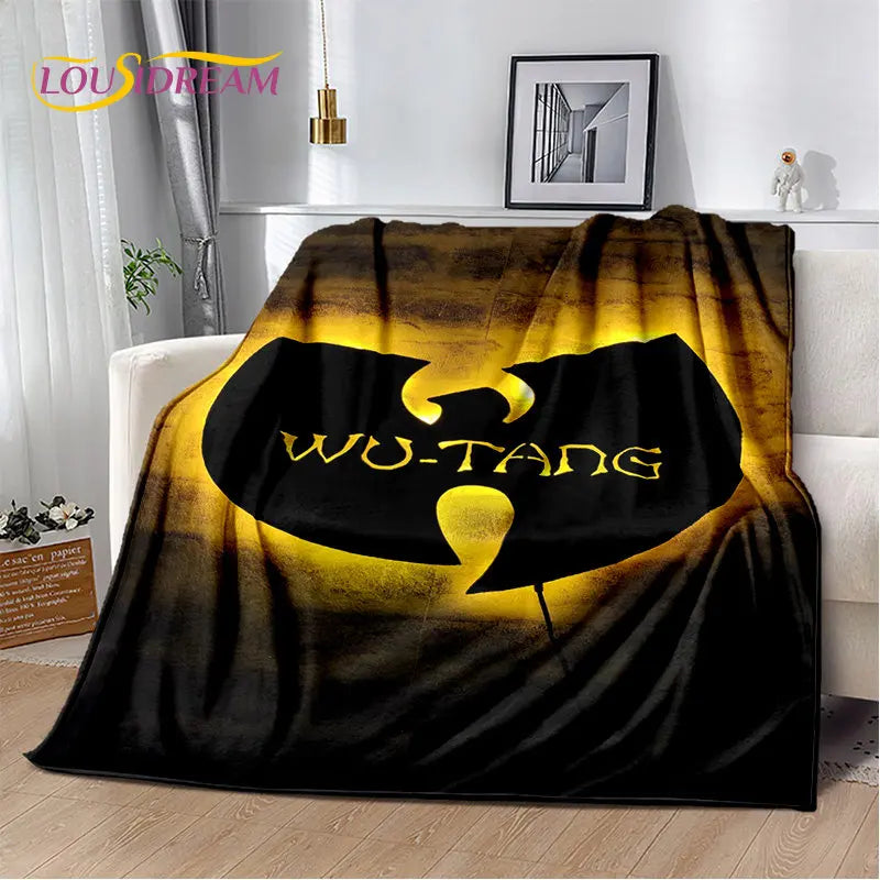 A dark fabric throw blanket featuring a large yellow silhouette of a stylized character on a black background.