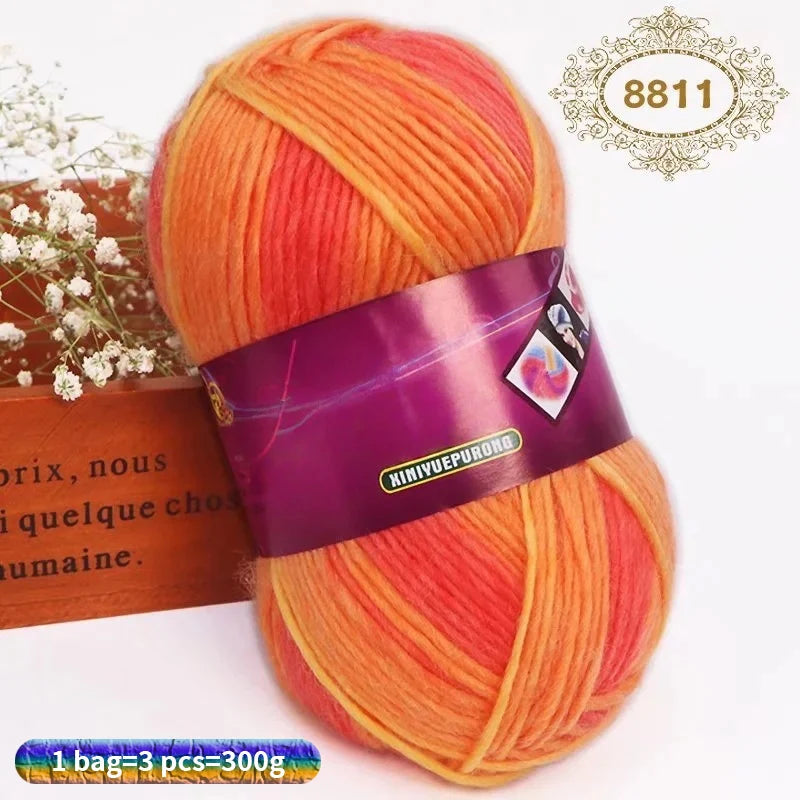 A ball of gradient orange and red wool yarn for hand knitting