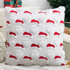 White knitted cushion cover with red Santa face patterns for Christmas decoration