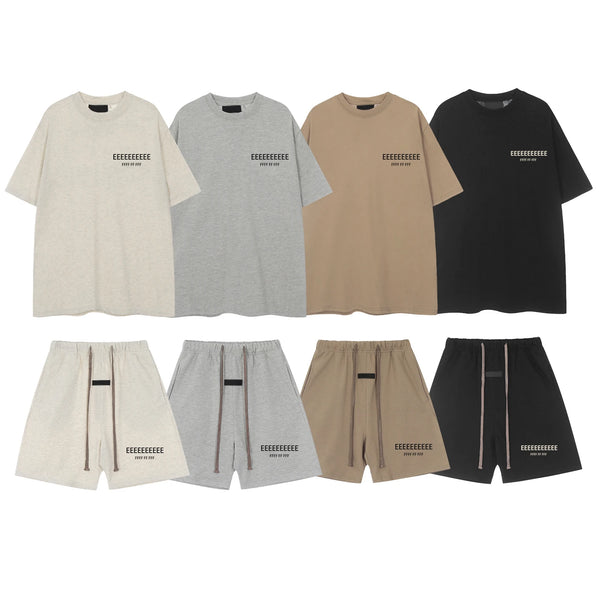 A set of a t-shirt and shorts in beige, gray, tan, and black with letter prints.