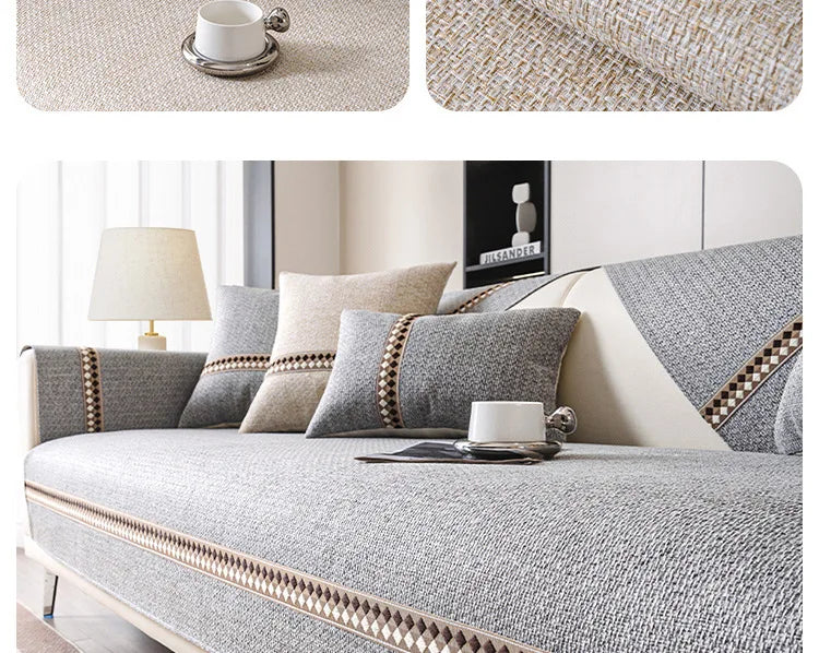 A light gray linen sofa cover with beige accents and a white cup on a modern sofa.