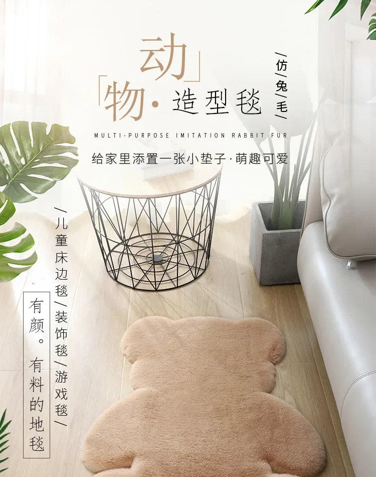 A plush bear-shaped imitation rabbit fur item displayed on a wooden surface.