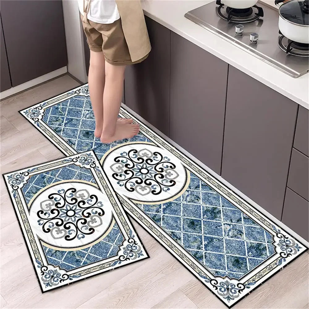 A set of two diamond print non-slip waterproof kitchen rugs featuring blue and white patterns on a light wood floor.