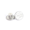 Silver metal button with a star design engraved on it for denim and clothing