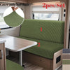 Two green stretchable cushion covers for an RV dinette seat with anti-slip backing.