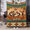 A soft flannel throw blanket featuring an ethnic print with geometric patterns and earthy tones.