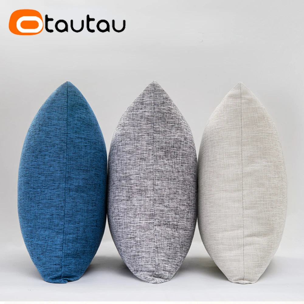Three oval cushion covers in blue gray and beige linen fabric displayed against a white background.
