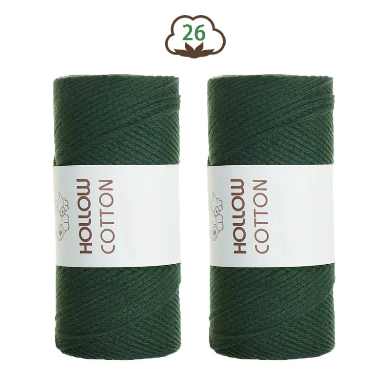 Two spools of dark green hollow cotton yarn for crafting