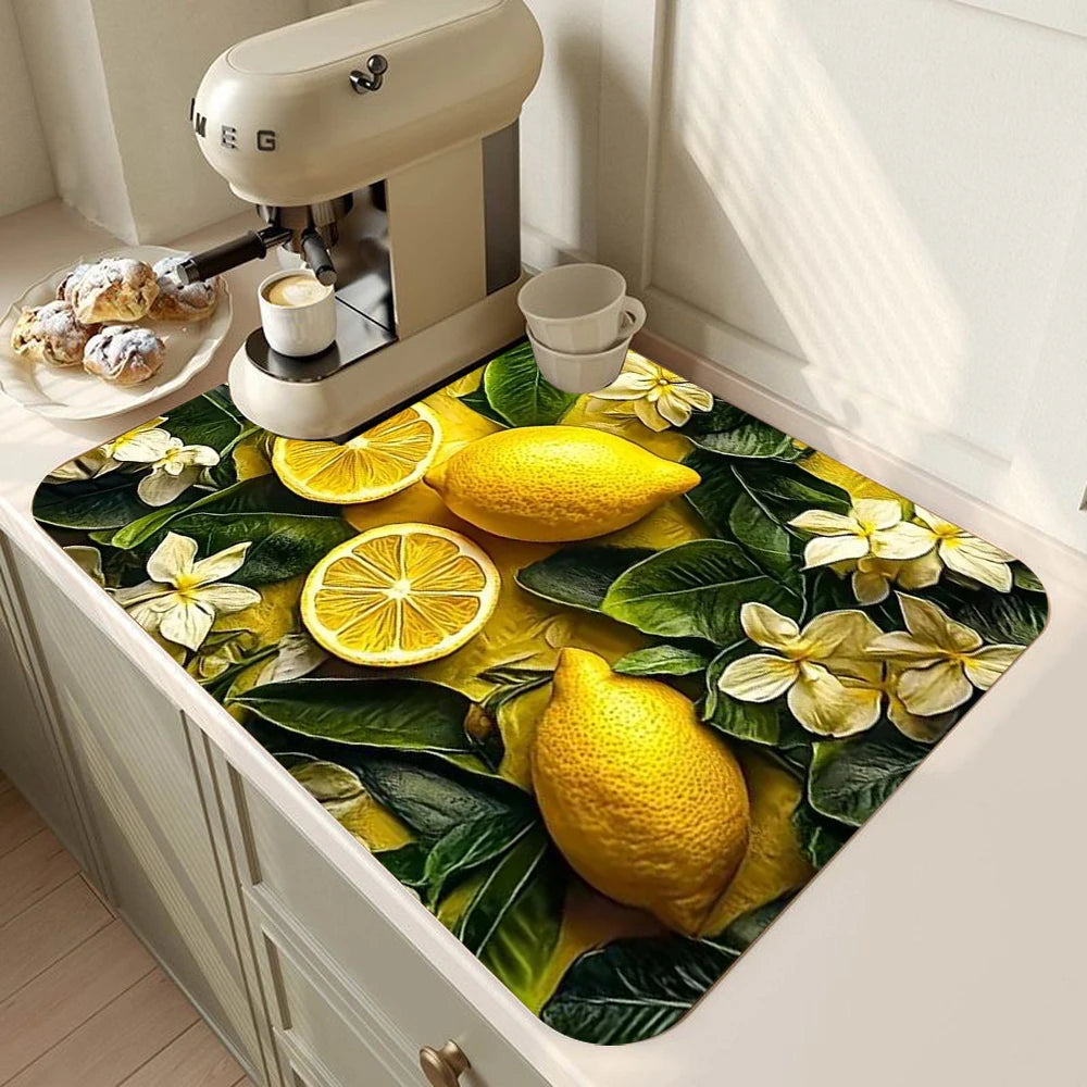A yellow lemon printed non-slip dish drying mat featuring lemons and green leaves.