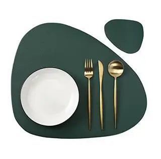 A set of gold-colored reusable vinyl placemats featuring a white plate and silverware on a dark green placemat.