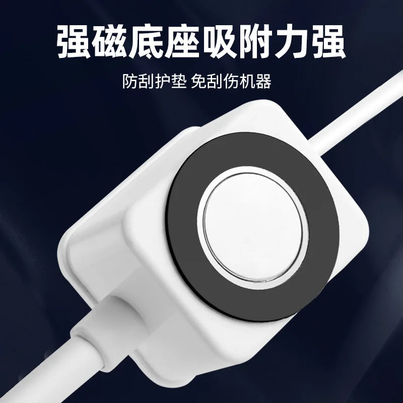 A white USB laser positioning light with a black circular lens and connector tip.