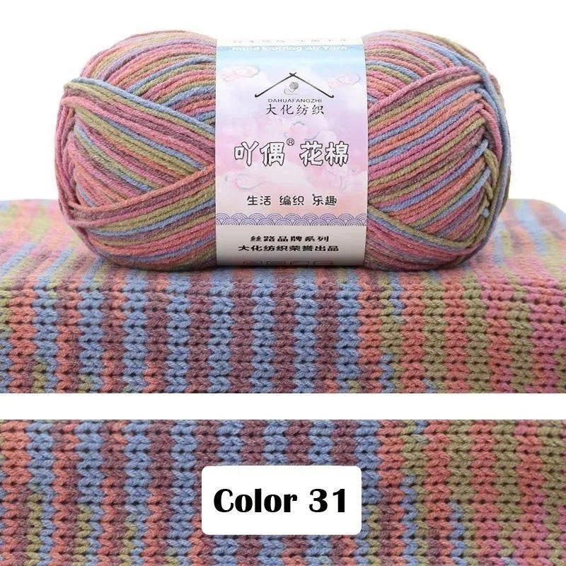 A ball of pink and purple gradient yarn labeled as 4-Ply Cotton Knit Yarn for Gradient Projects
