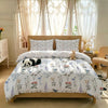 A light floral duvet cover set displayed on a wooden bed with sheer curtains and natural light.