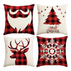 A set of four Christmas themed pillows featuring a plaid design, a reindeer head, and a snowflake pattern.