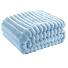 A stack of light blue fluffy flannel throw blankets folded neatly.