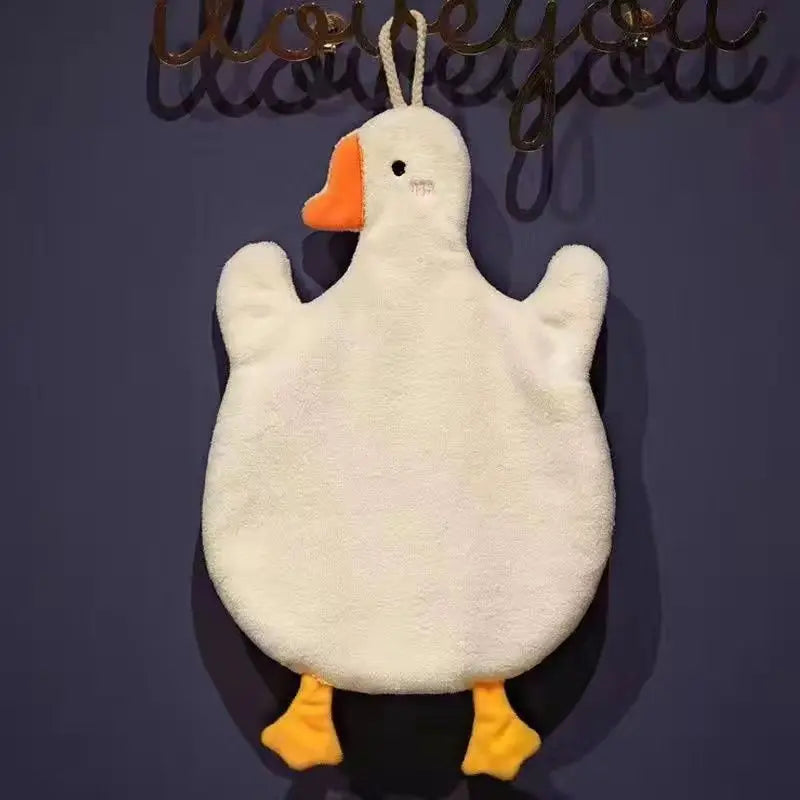 A fluffy white cartoon goose hanging hand towel with an orange beak and yellow feet.