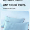 Light blue cooling bean pillowcases and a fitted sheet type mat are displayed on a white surface.