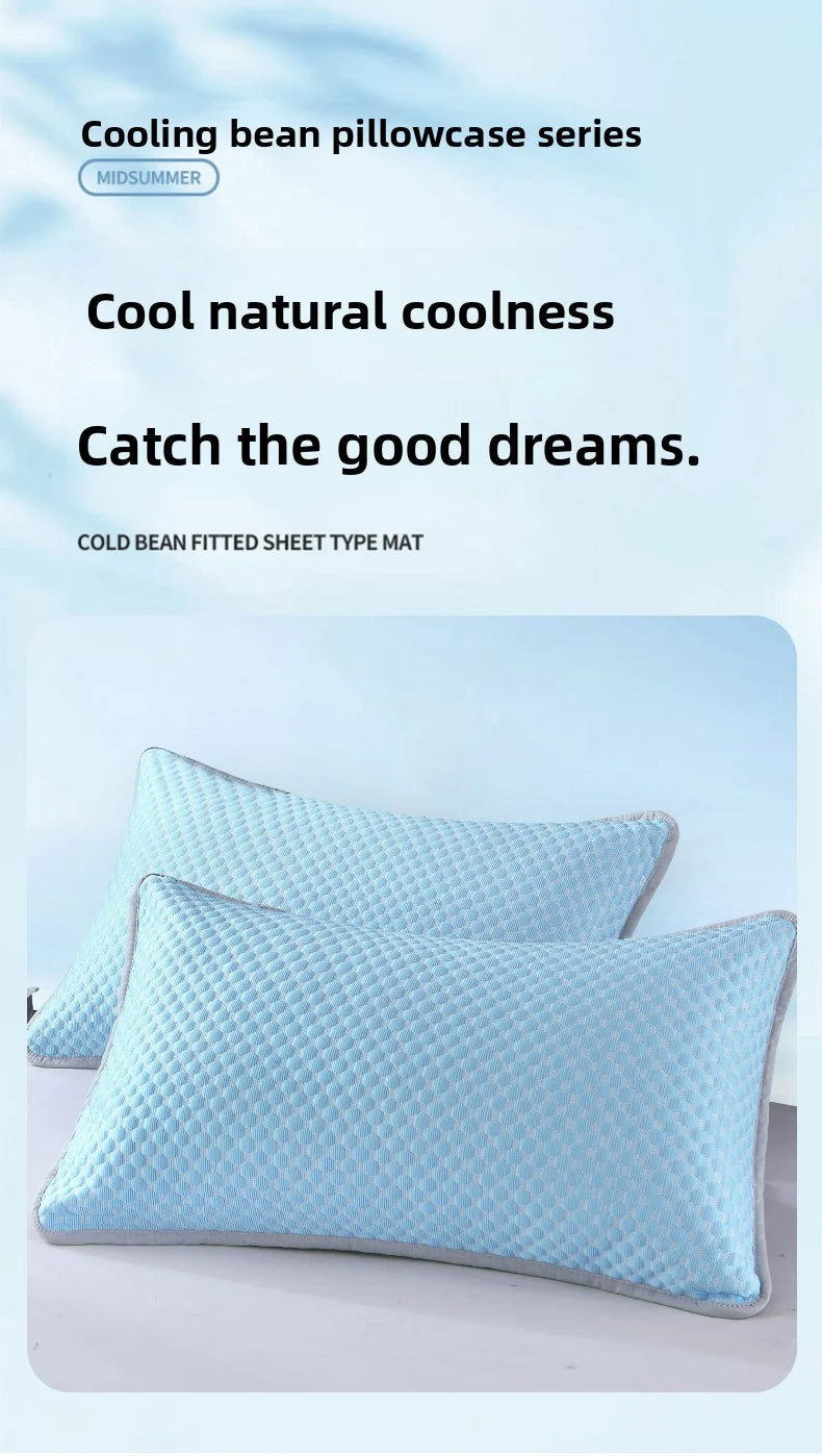 Light blue cooling bean pillowcases and a fitted sheet type mat are displayed on a white surface.
