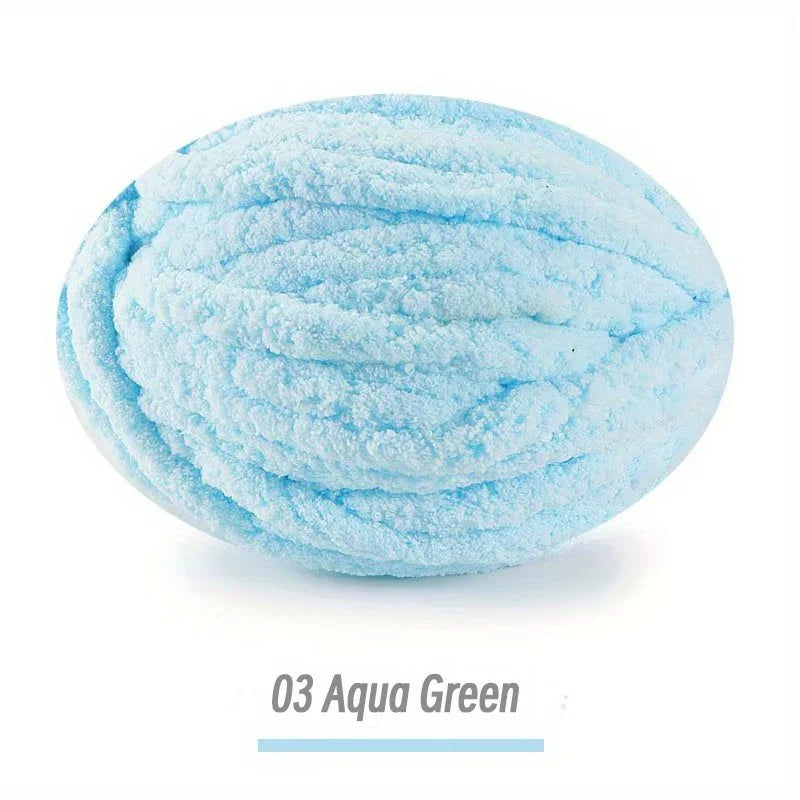 A ball of light blue aqua green extra thick hand-knitted yarn for crafting and gifts.
